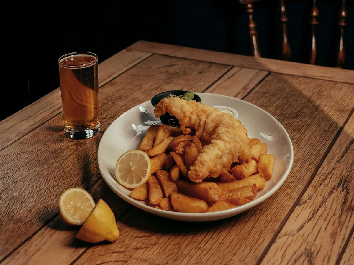 Photo by Camille C: https://www.pexels.com/photo/fish-potato-chips-and-lemon-slice-on-plate-10549666/