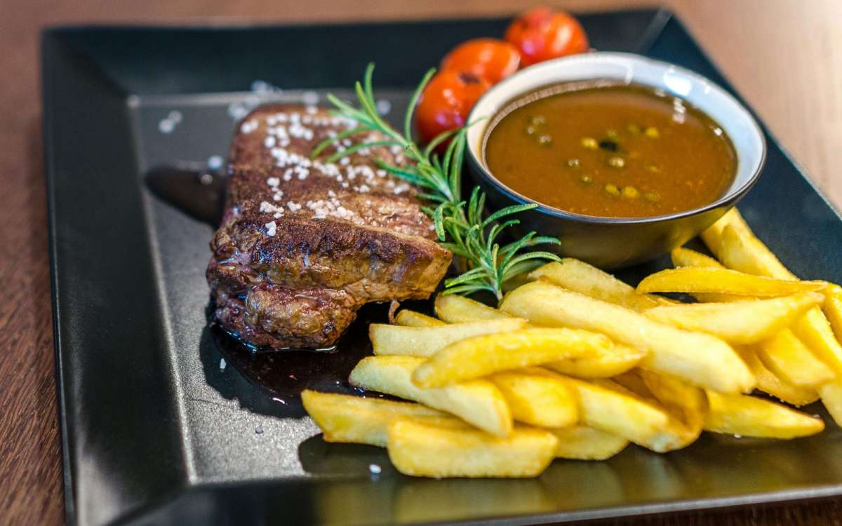 Photo by Lukas: https://www.pexels.com/photo/grilled-beef-with-fries-and-sauce-on-black-ceramic-plate-1352264/