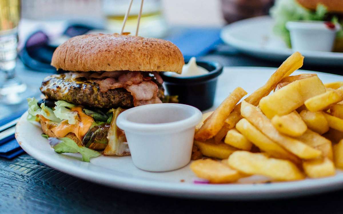 Photo by Robin Stickel: https://www.pexels.com/photo/fries-and-burger-on-plate-70497/